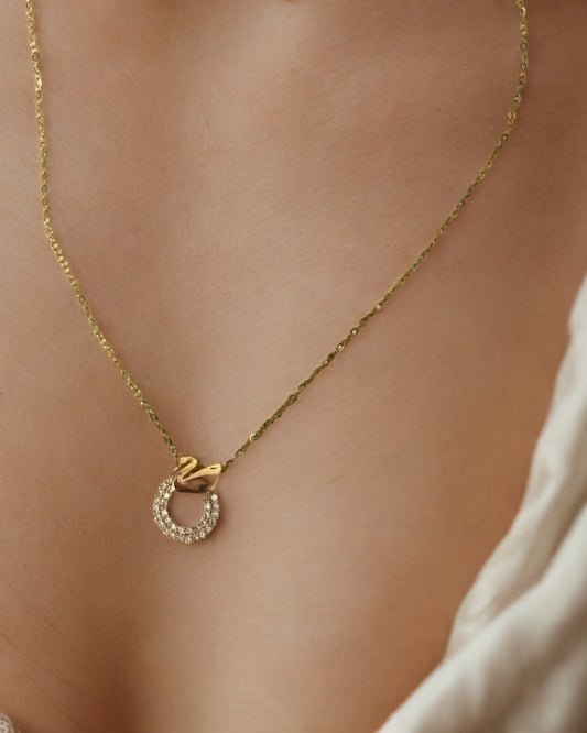 Luxury gold chain necklace with halo pendant by KLYAA, displayed on model neck