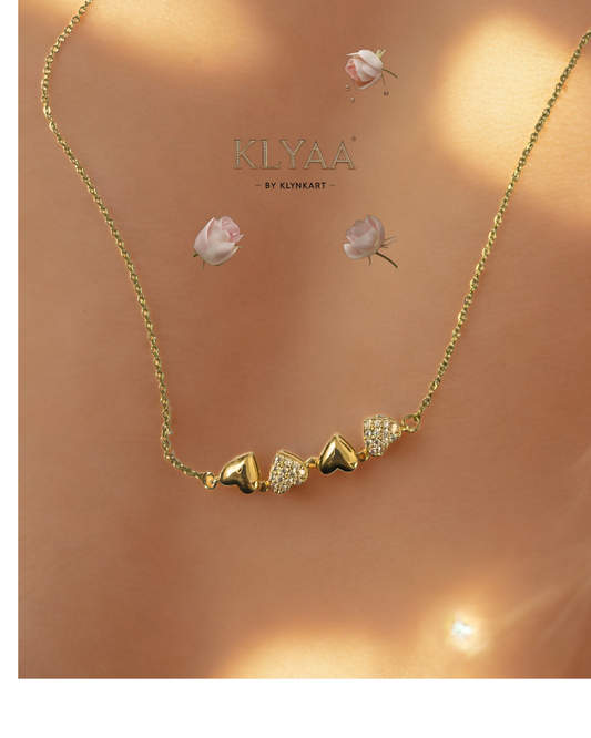 “Four-heart gold bar necklace by KLYAA with sparkling zircon hearts”