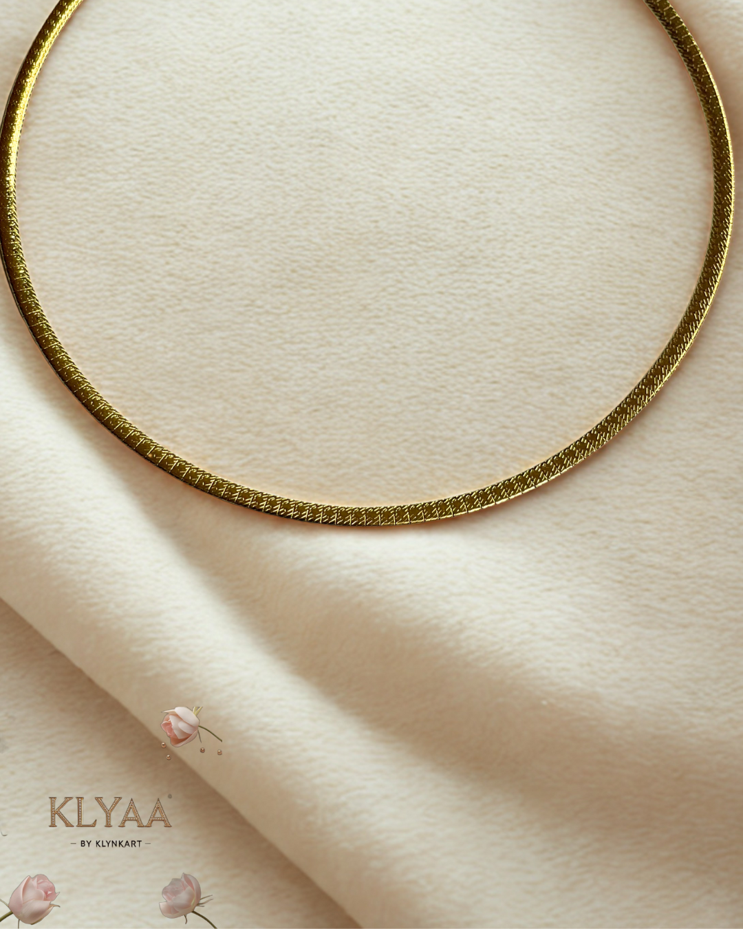 Sleek 18K Gold Plated anti-tarnish huslee neckpiece by KLYAA styled on soft beige fabric