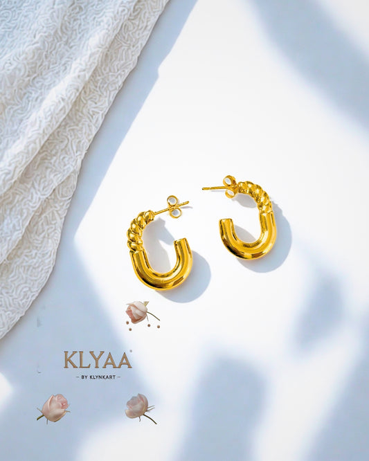 Twisted anti-tarnish gold hoops by KLYAA with minimalist aesthetic