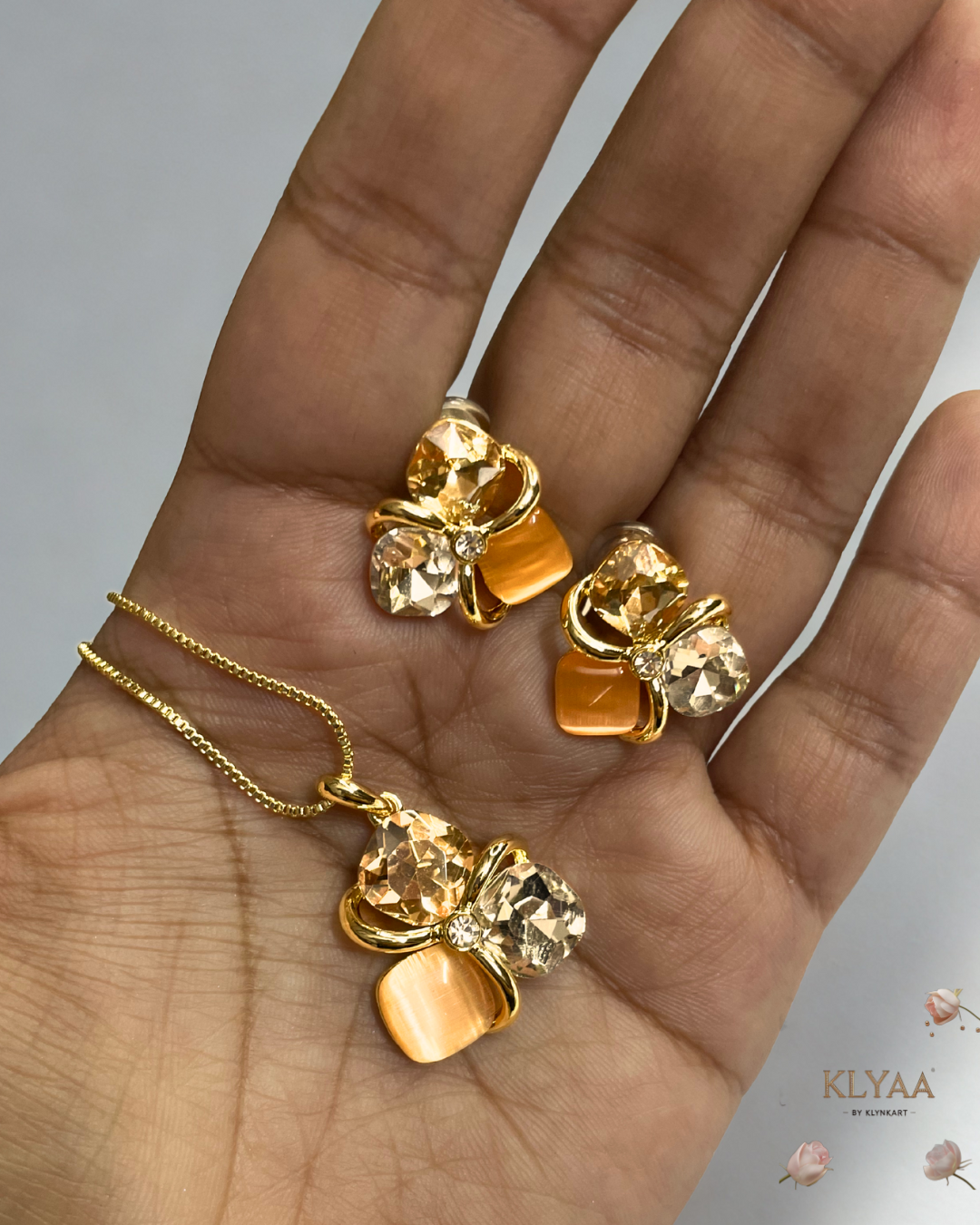Golden peach crystal pendant set with matching studs, dual-tone anti-tarnish chain, KLYAA Signature Jewellery.