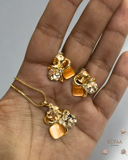 Golden peach crystal pendant set with matching studs, dual-tone anti-tarnish chain, KLYAA Signature Jewellery.