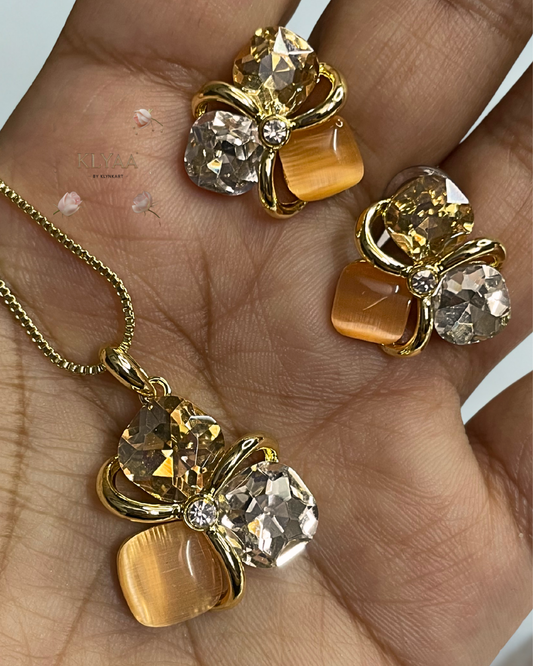 Golden peach crystal pendant set with matching studs, dual-tone anti-tarnish chain, KLYAA Signature Jewellery.