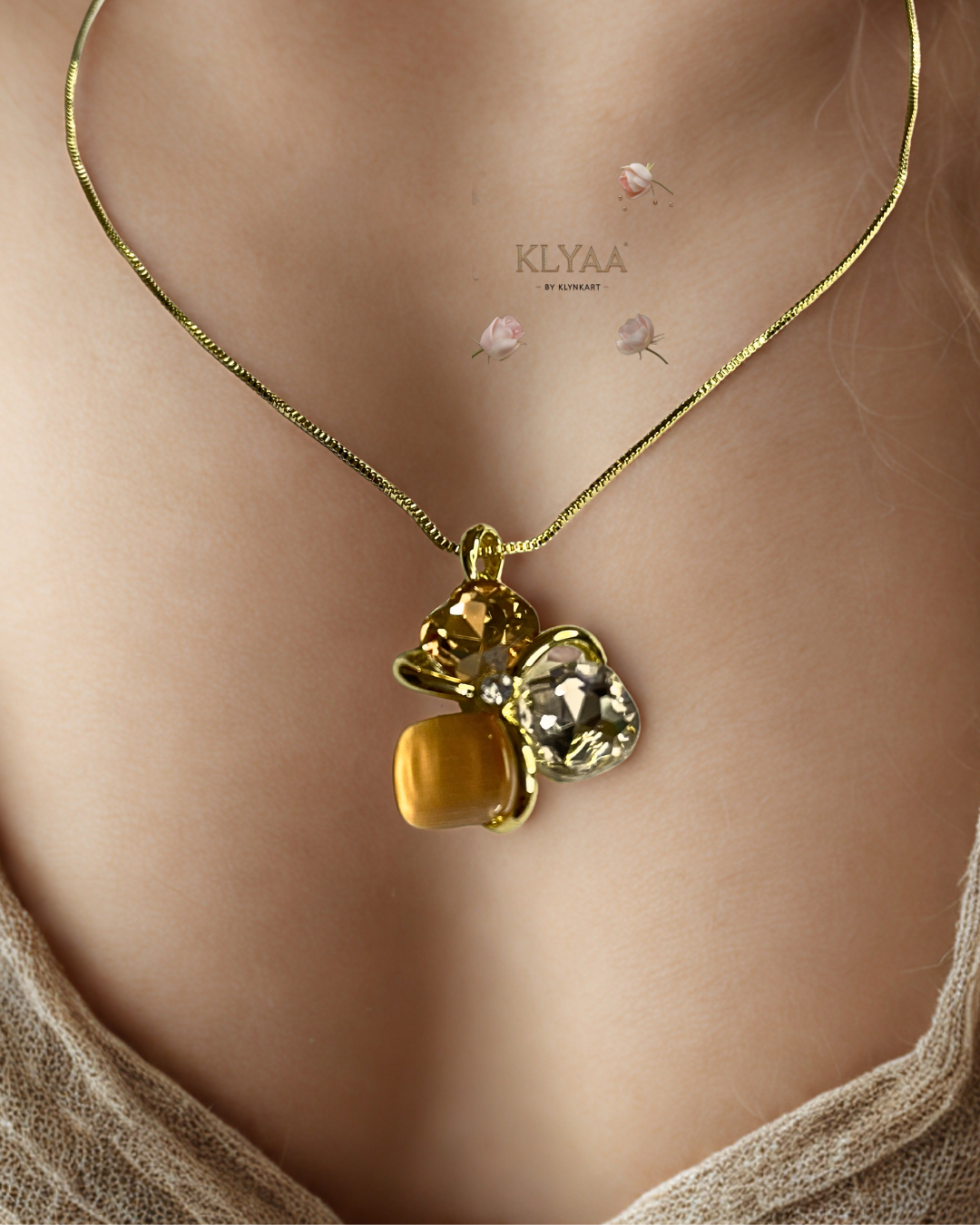 Golden peach crystal pendant set with matching studs, dual-tone anti-tarnish chain, KLYAA Signature Jewellery.