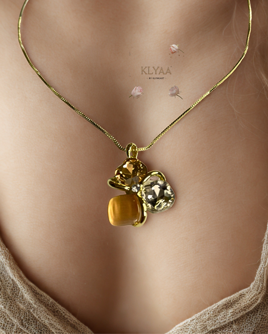 Golden peach crystal pendant set with matching studs, dual-tone anti-tarnish chain, KLYAA Signature Jewellery.