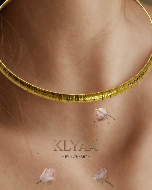 Elegant sculpted gold collar chain from KLYAA on model's neck