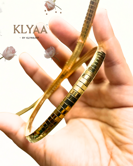 Broad 18K Gold Plated anti-tarnish huslee neckpiece by KLYAA on textured white background
