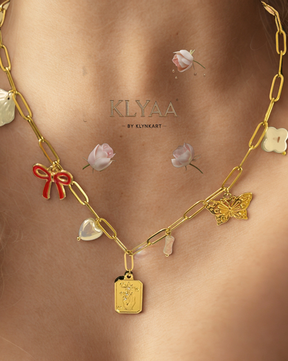 Gold-plated charm necklace with red bow, butterfly, pearls and crest pendant – anti-tarnish chain by KLYAA