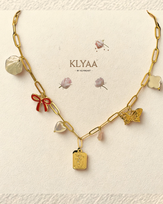 Gold-plated charm necklace with red bow, butterfly, pearls and crest pendant – anti-tarnish chain by KLYAA