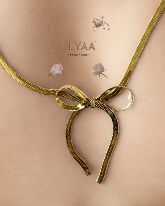 Golden bow tie chain necklace with adjustable clasp – elegant minimalist jewellery by KLYAA