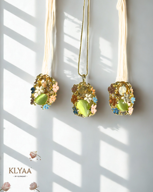 Meadow Muse pendant set with pastel floral crystals and mint green gemstone on anti-tarnish 18K gold dual-tone chain by KLYAA Signature Collection