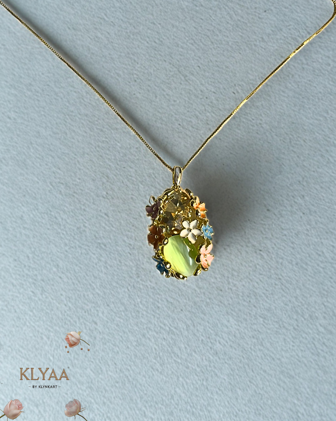 Meadow Muse pendant set with pastel floral crystals and mint green gemstone on anti-tarnish 18K gold dual-tone chain by KLYAA Signature Collection