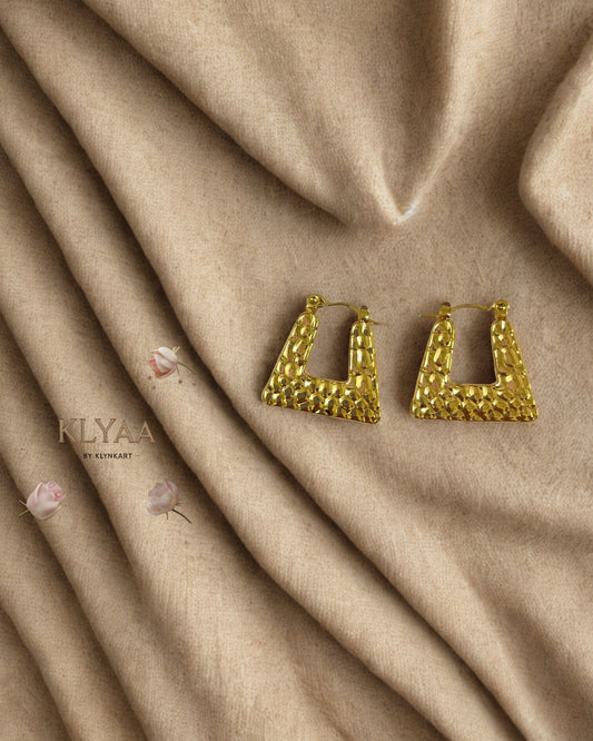 KLYAA anti-tarnish geometric hammered gold earrings on white textured fabric