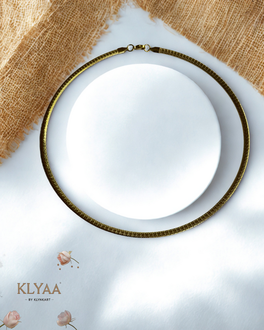 Sleek 18K Gold Plated anti-tarnish huslee neckpiece by KLYAA styled on soft beige fabric