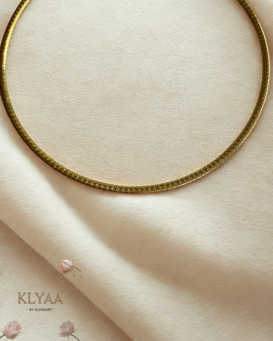 Sleek 18K Gold Plated anti-tarnish huslee neckpiece by KLYAA styled on soft beige fabric