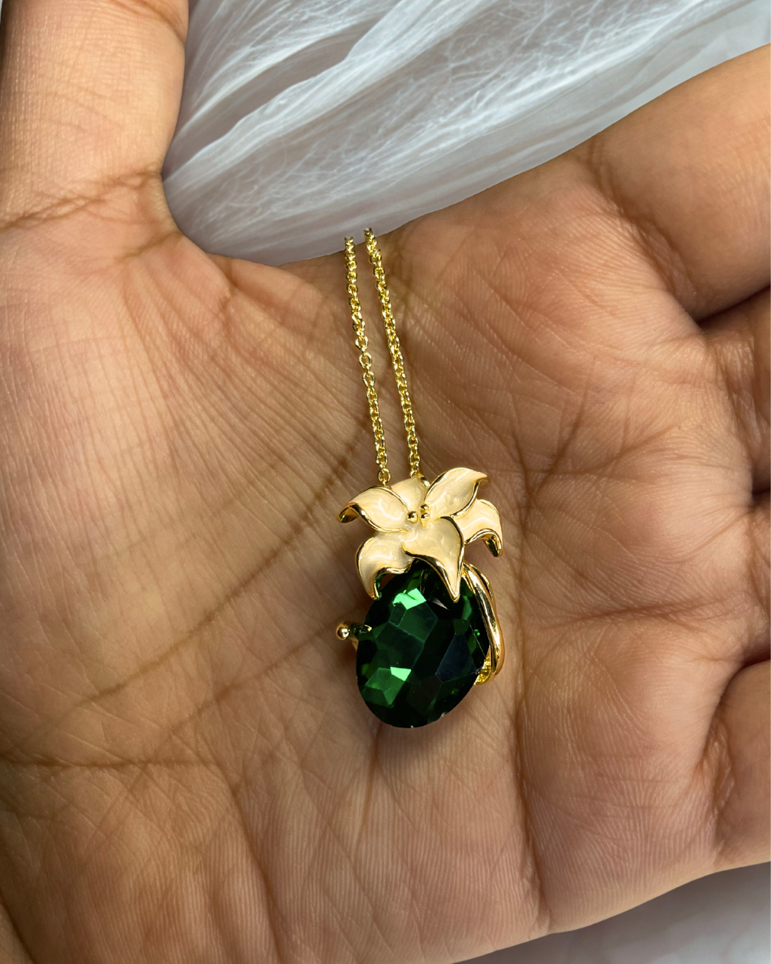 Signature emerald green crystal pendant with gold floral top on dual-tone chain – anti-tarnish premium jewellery by KLYAA