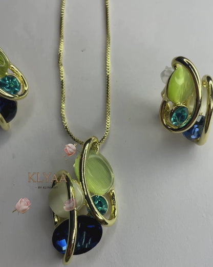 Elysian Swirl crystal pendant set with abstract multi-stone design in dual-tone chain – Signature limited edition jewellery by KLYAA