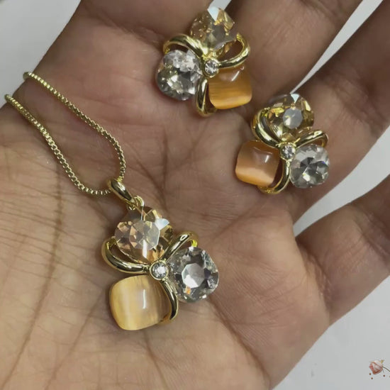 Golden peach crystal pendant set with matching studs, dual-tone anti-tarnish chain, KLYAA Signature Jewellery.